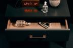 Überlube Signature Bottle on a nightstand at night
